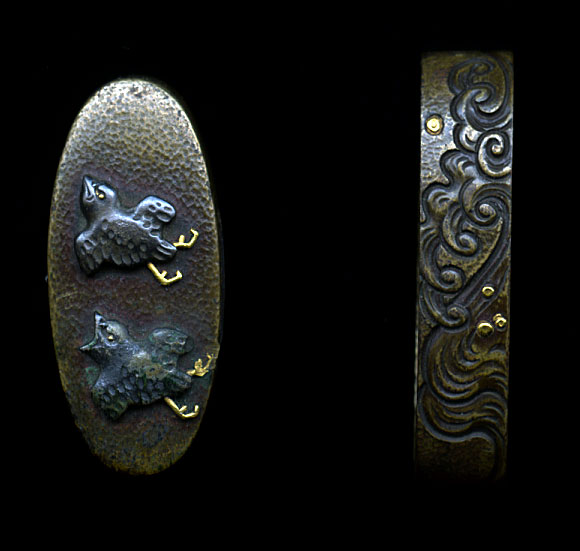 Signed Hamano School set of fuchi kashira. Done in Shinchu, with use of gold and silver for the accents, this is a very pleasant set for mounting. The design of birds and waves is always a nice theme, and is well executed here in this set. The signature is that of Kenzui who is very well known from the Hamano School.